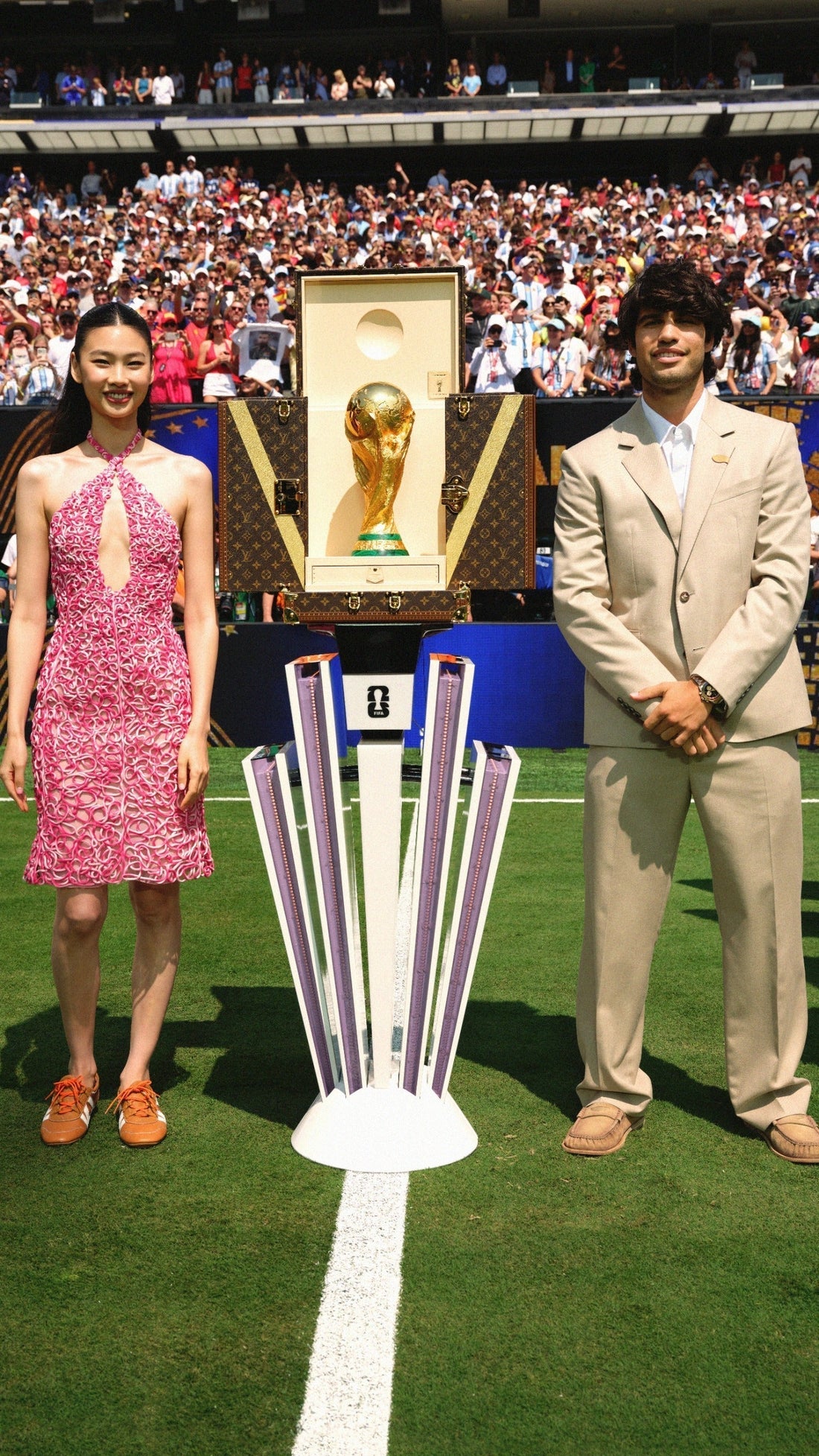 Carlos Alcaraz and Hoyeon present Louis Vuitton’s World Cup Trunk as Spain lifts the winner’s trophy