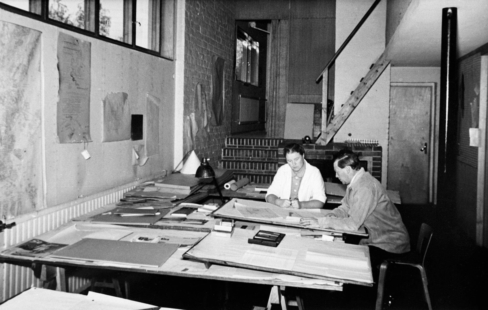 An original image of the Aaltos working together at their architectural practice. Photography by the Alvar Aalto Foundation