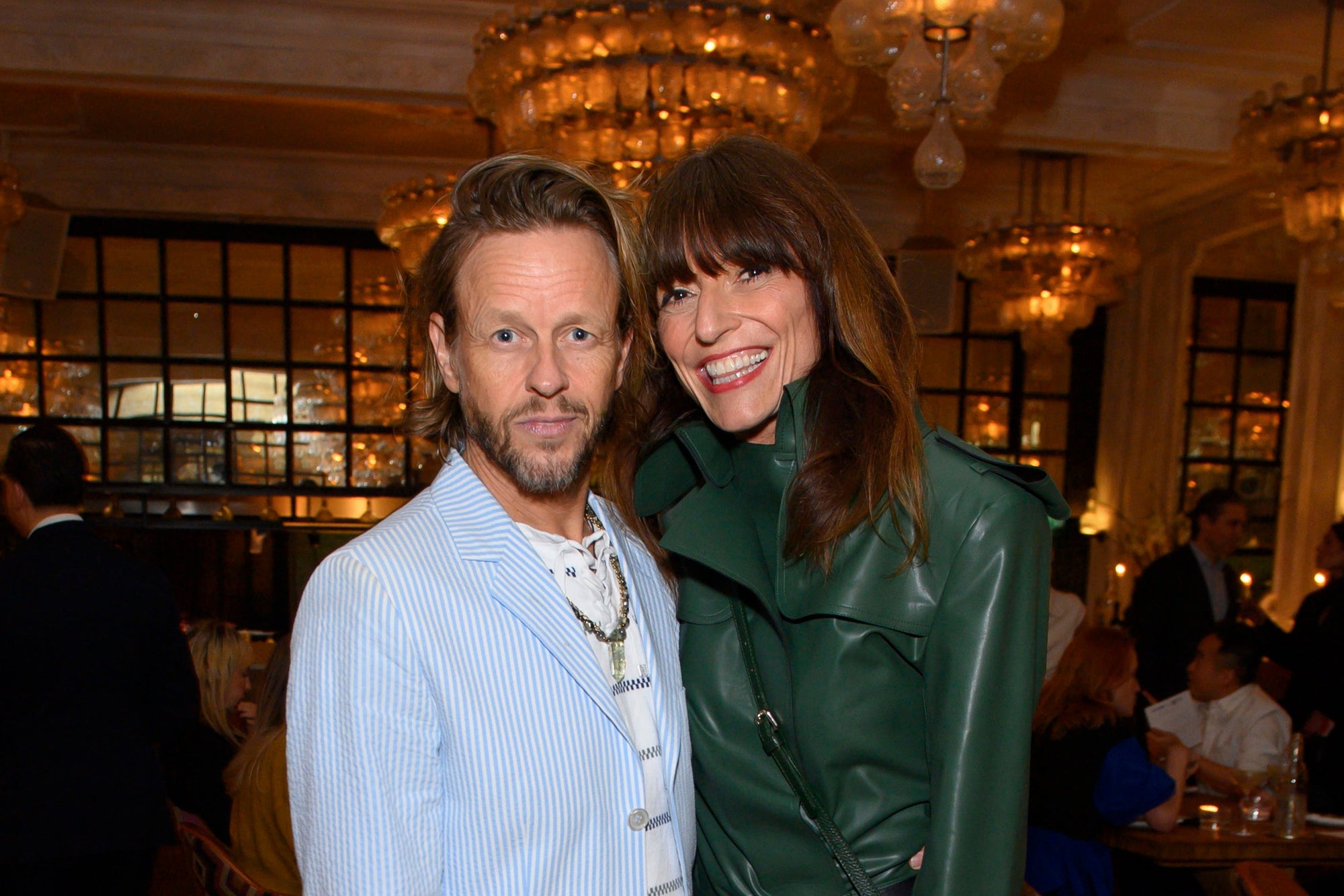 Davina McCall showcases her gorgeous figure in a green leather jumpsuit as she puts on a love-up display with husband Michael Douglas