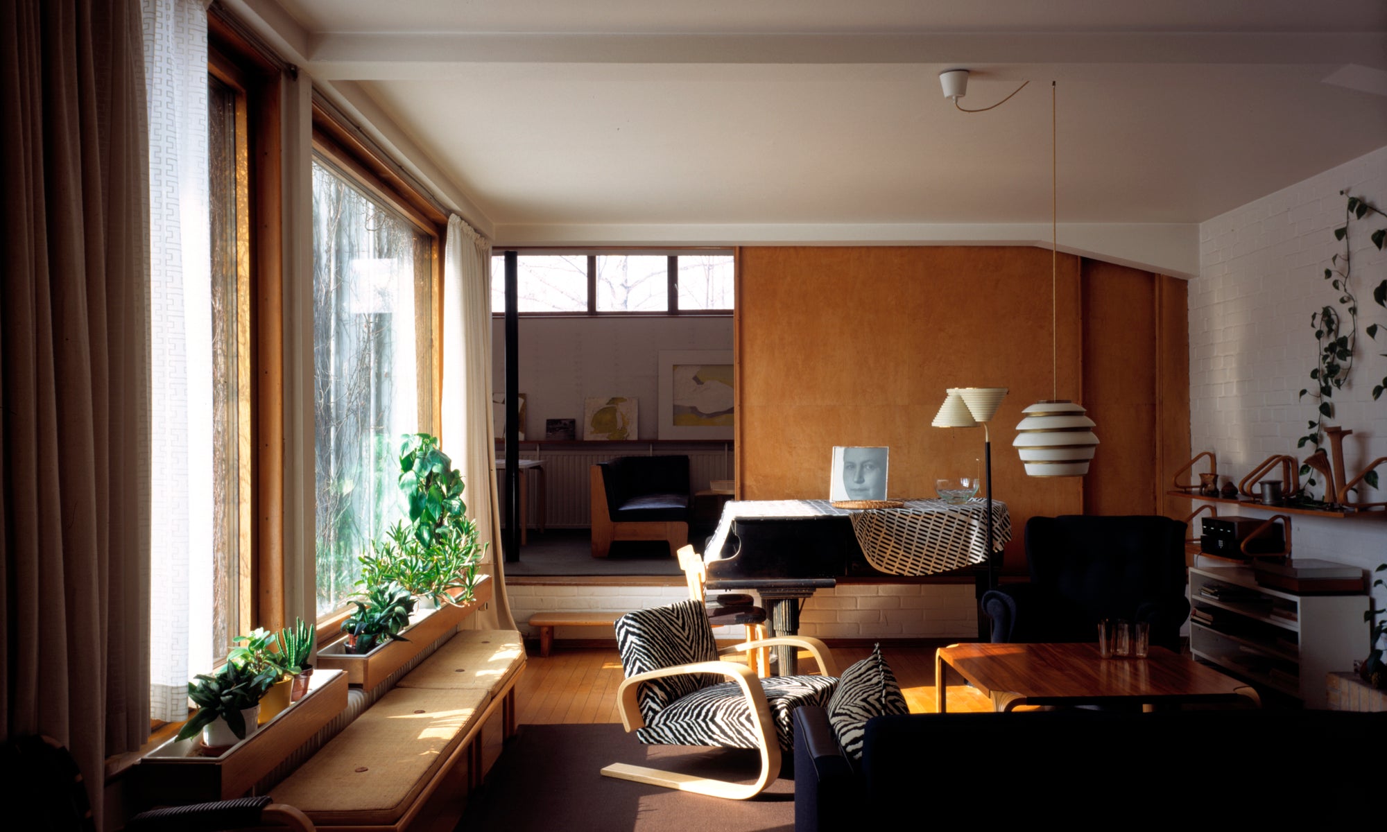 The living room in the Aalto House (Villa Aalto), located in the Munkkiniemi district of Helsinki at Riihitie 20, which was designed by Aino and Alvar Aalto as their family home and studio, completed in 1936. It now functions as a home museum, showcasing their signature "functional beauty" with natural materials, light-filled spaces, and an integrated, intimate living/working design, open to the public.